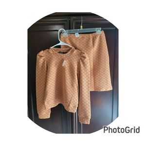 New with tags. Chevron puff sleeve tee and matching Chevron pull on skirt.